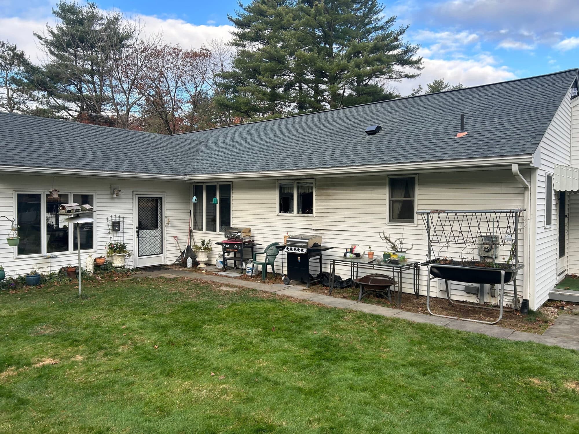 Ranch home with a rear patio and exterior trim in Central Connecticut