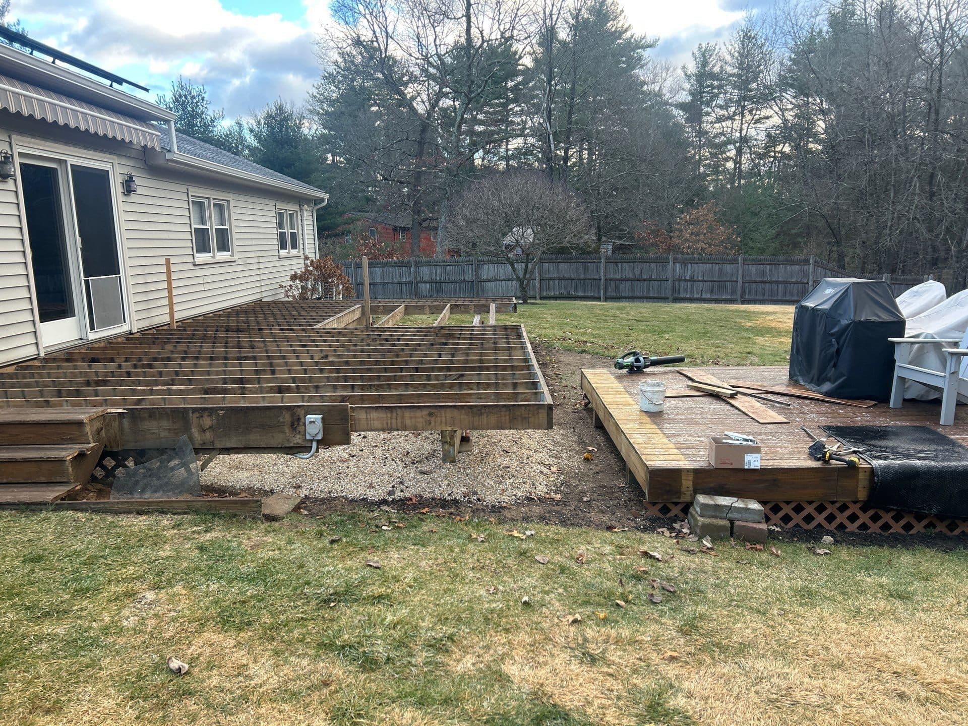 Tan Connecticut home with a newly framed deck