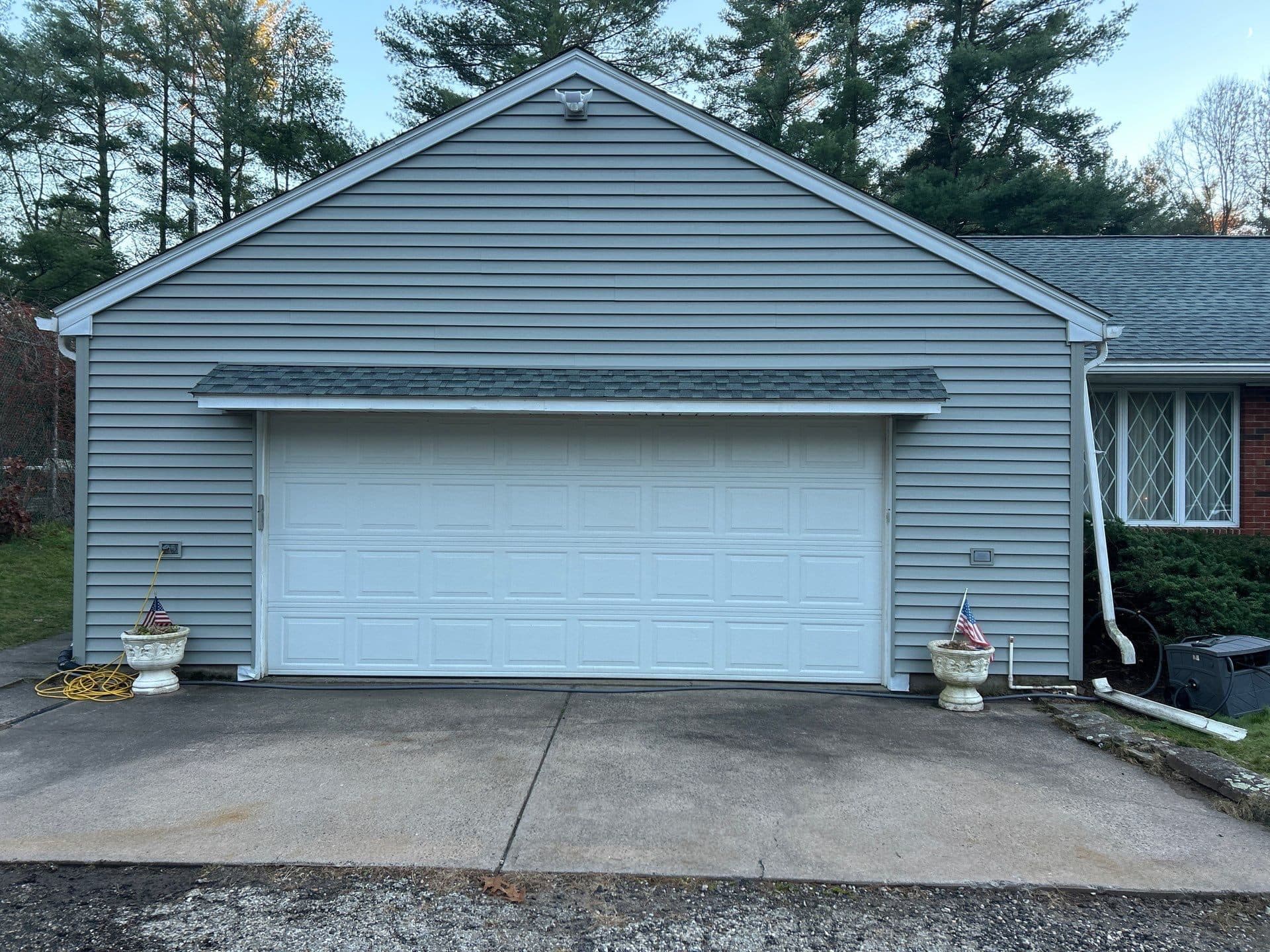 White Central Connecticut home with a finished driveway