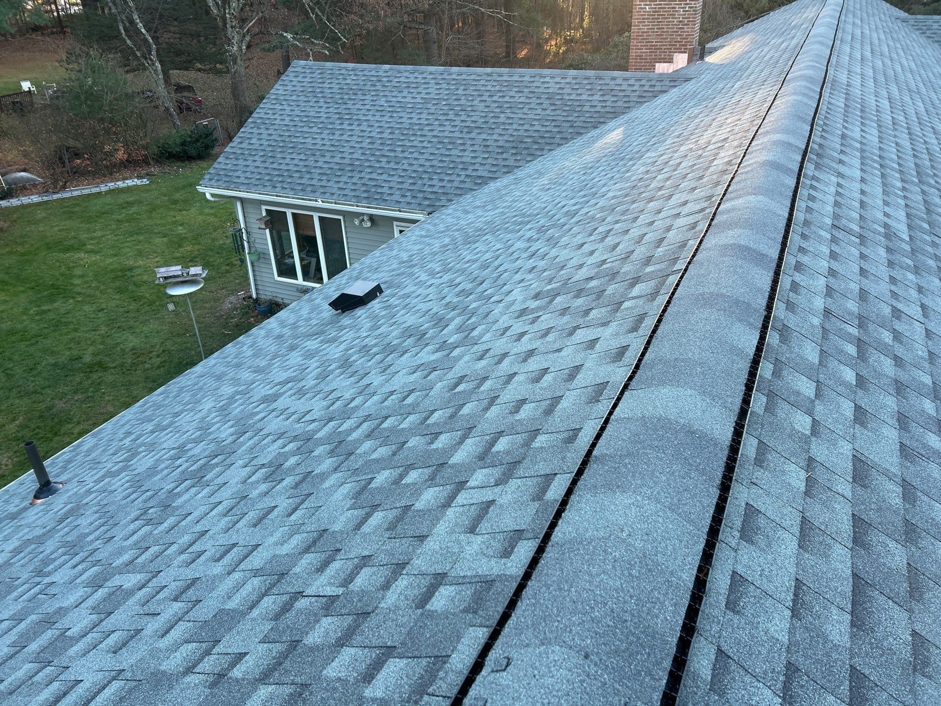 Aerial view of a newly installed shingle roof on a Central Connecticut home