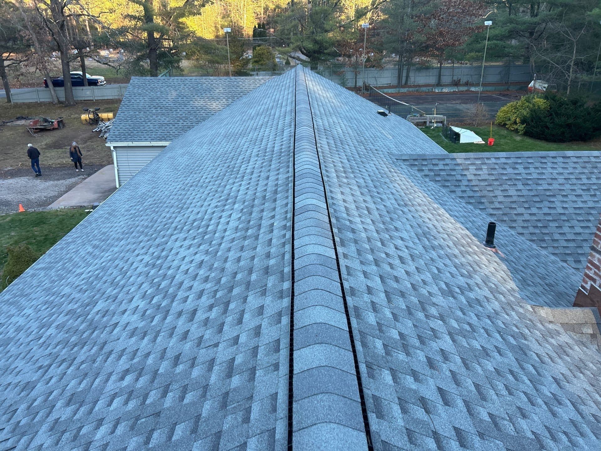 Aerial view of a new shingle roof ridge in Central Connecticut