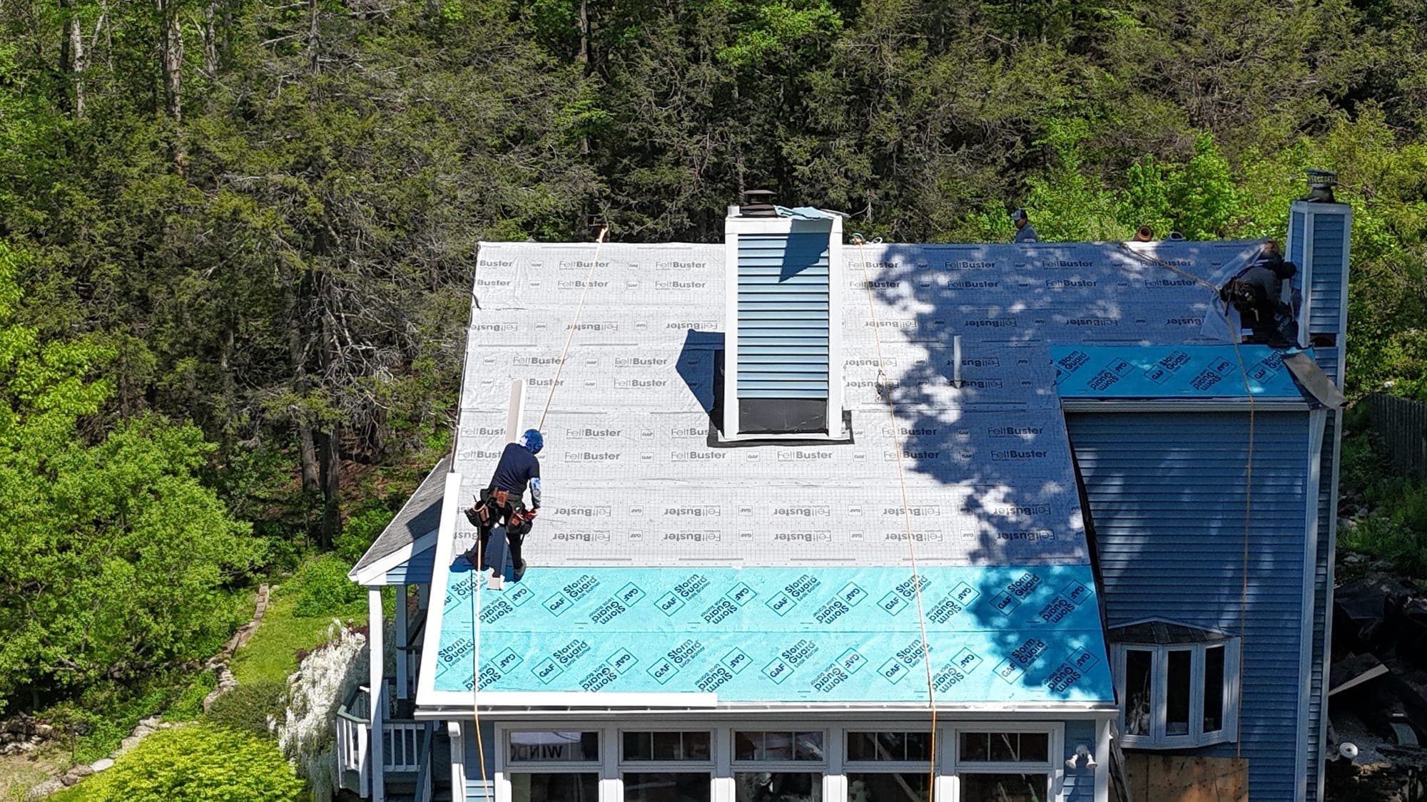 Roof deck and synthetic underlayment stage during a replacement
