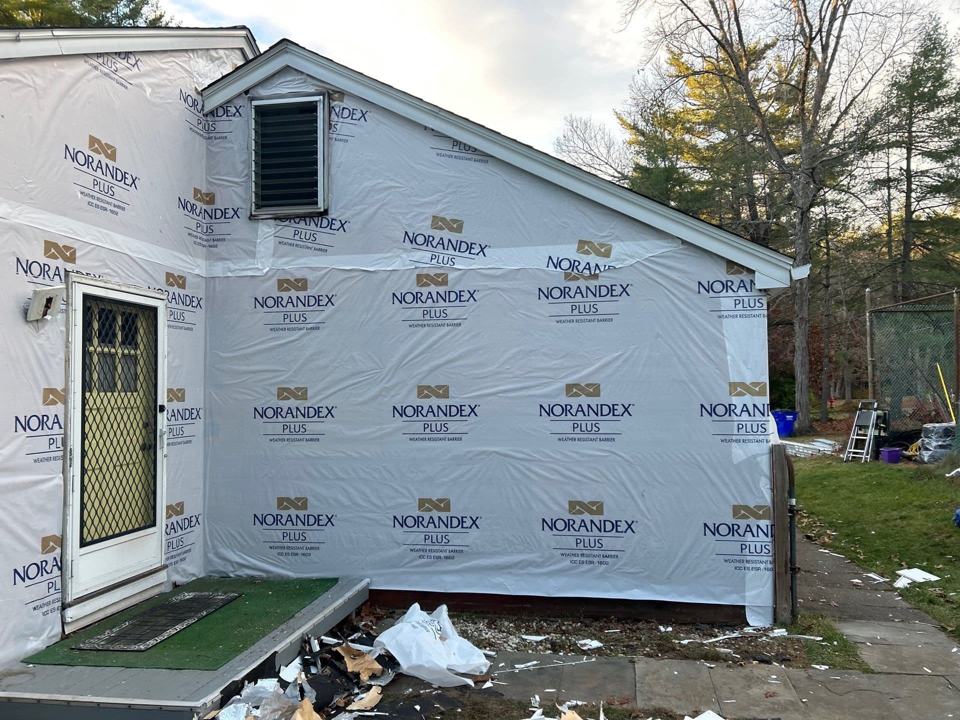 New gutters and trim running along a sided home exterior
