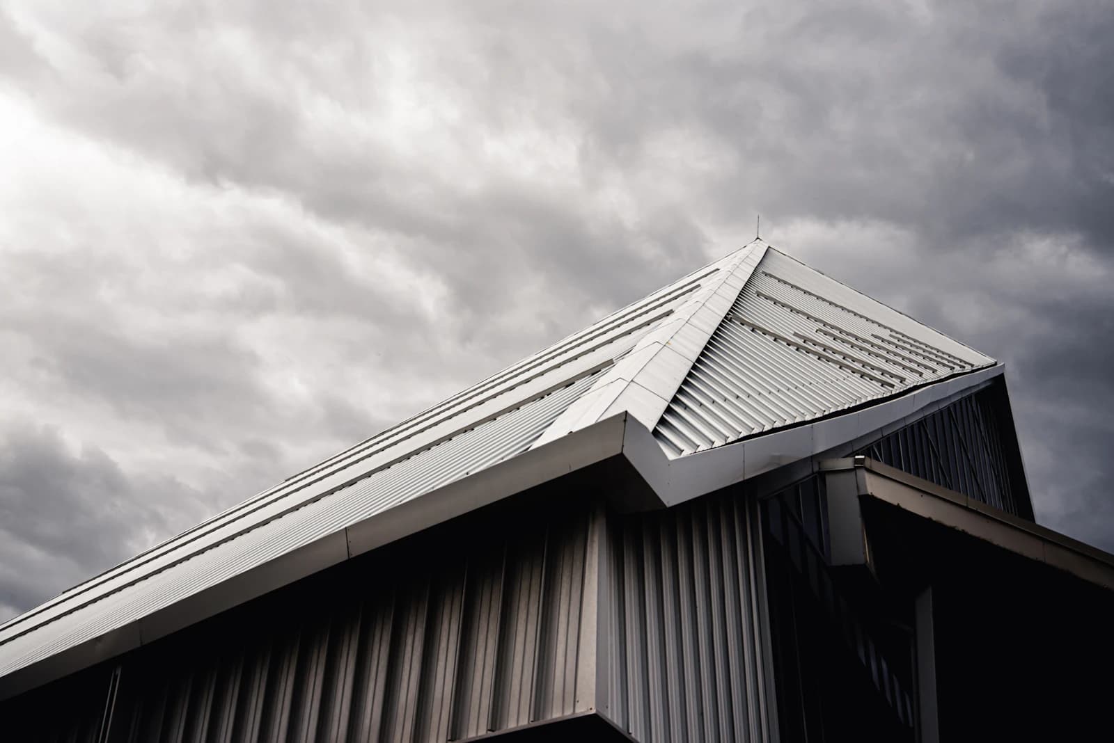Trim, flashing, and roofline detail framing a residential window opening