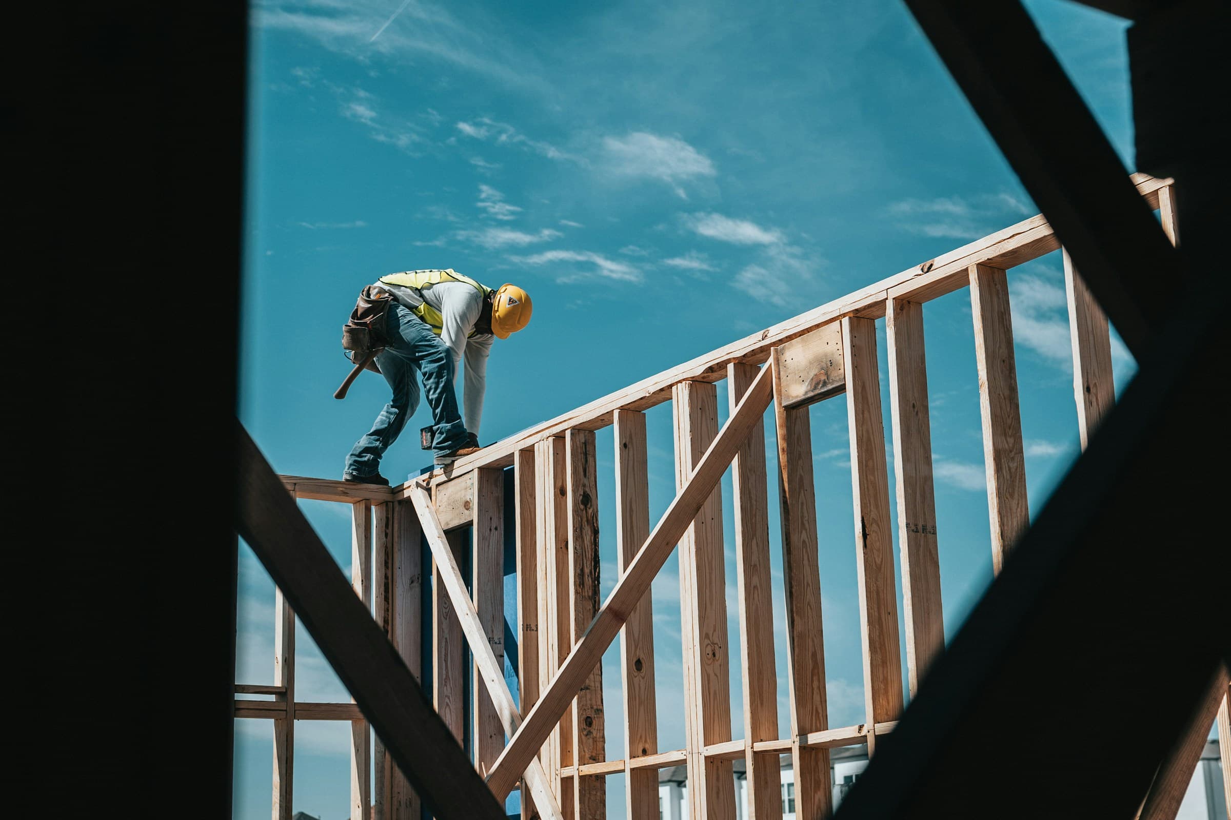 Carpenter framing exterior trim on a Central Connecticut home